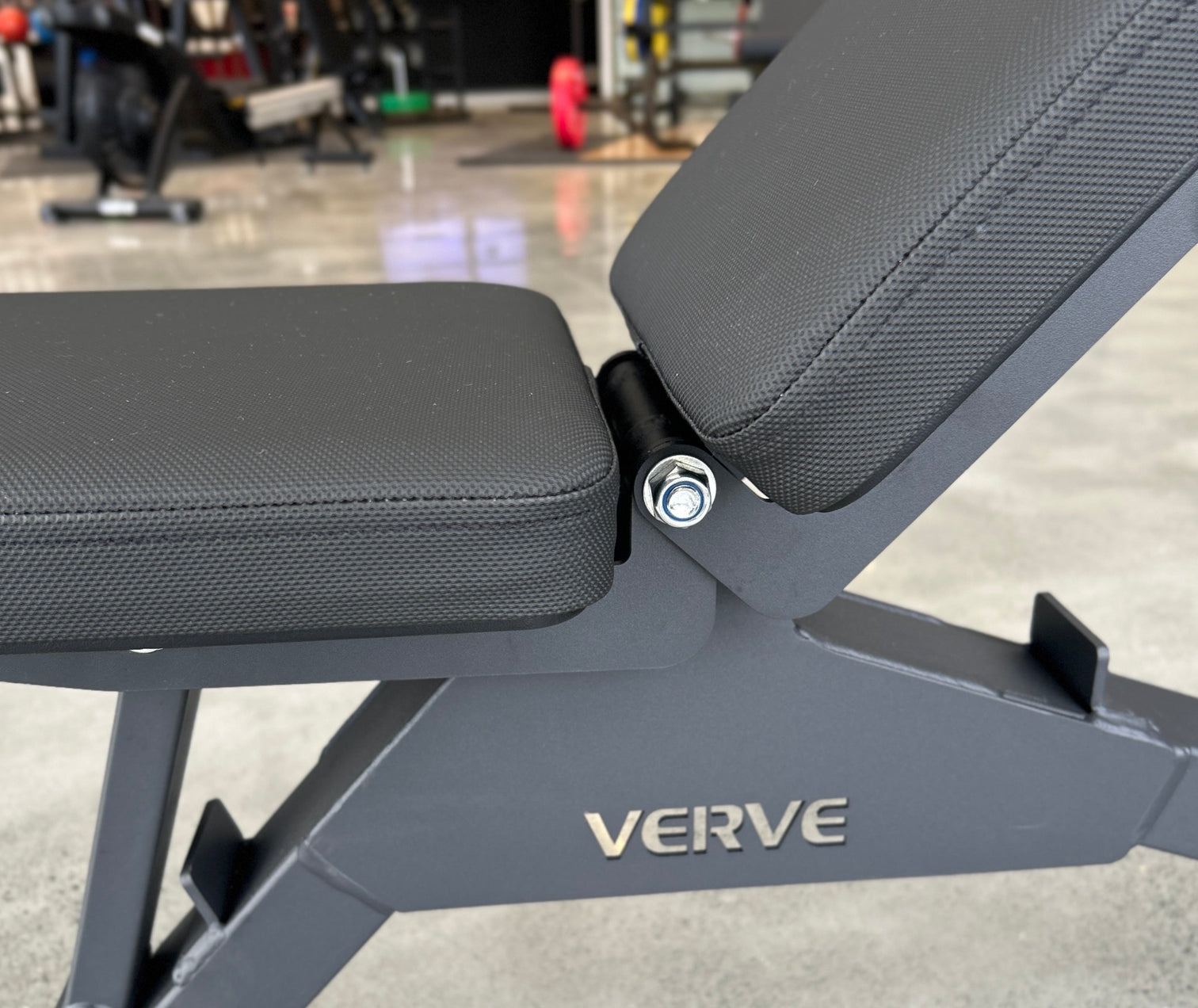 Close-up of the seat-to-back pad gap and hinge on a VERVE Satori adjustable bench