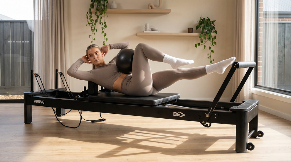 Woman Doing Pilates On Reformer