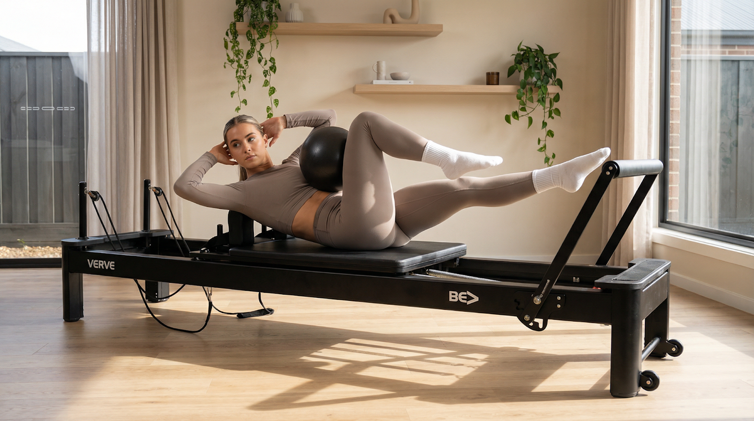 Woman Doing Pilates On Reformer