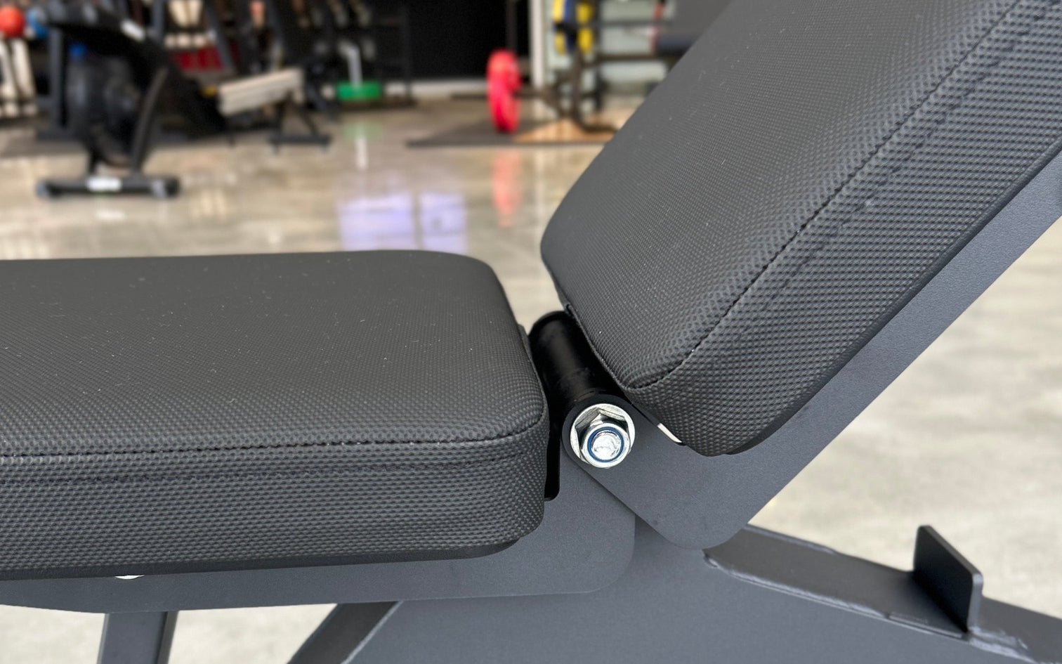 Close-up of the seat-to-back pad gap and hinge on a VERVE Satori adjustable bench
