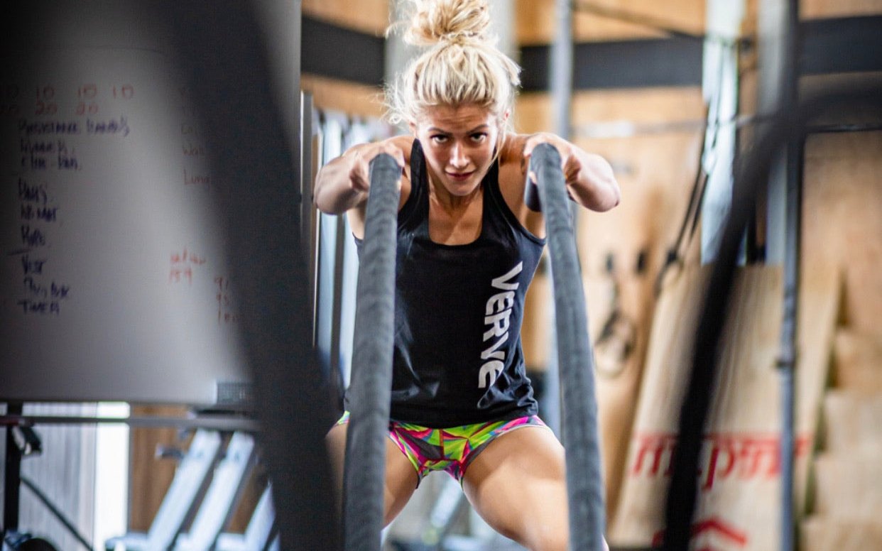 Athlete training with VERVE battle ropes in a functional gym