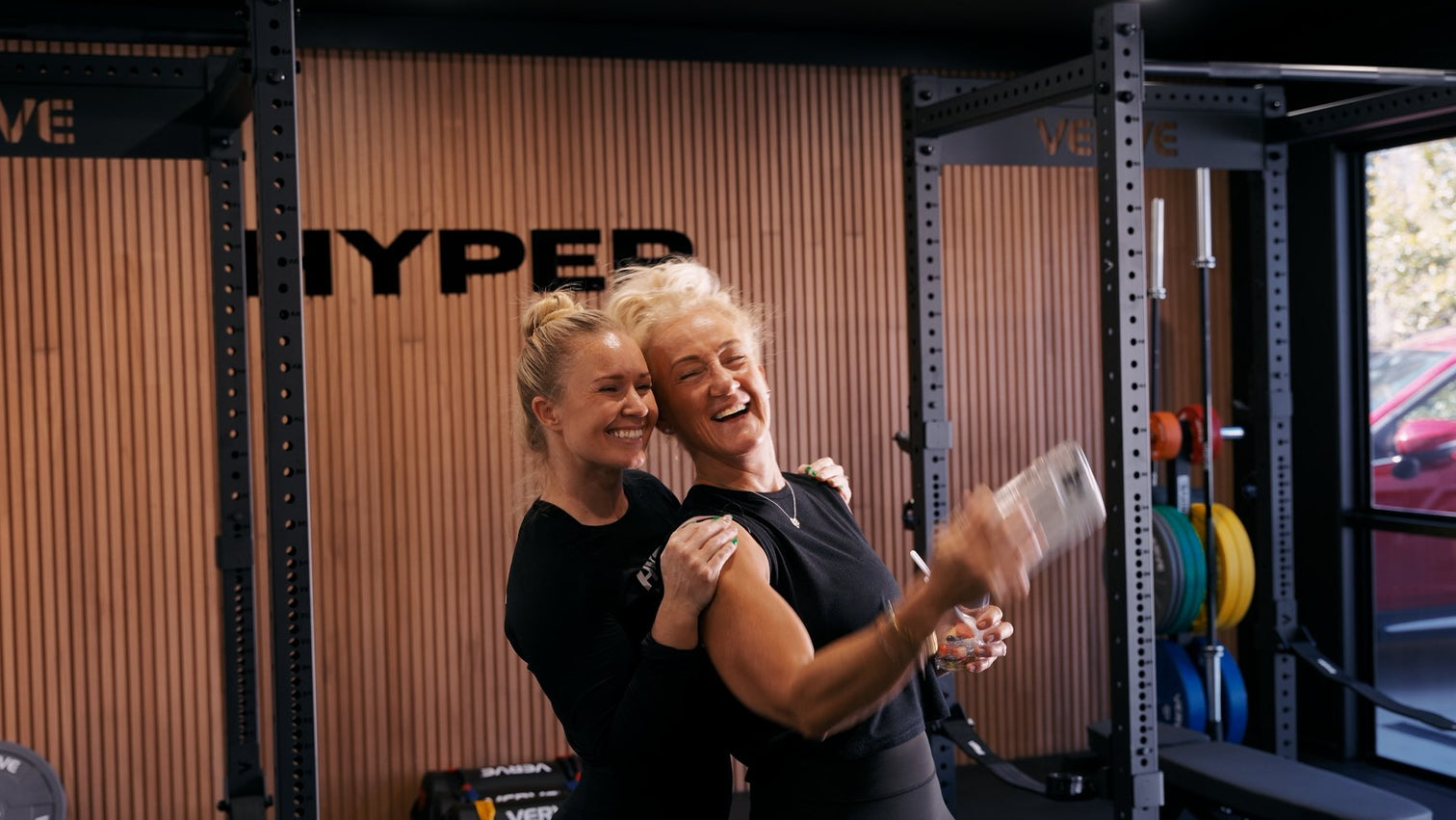 Two older women training together with VERVE equipment
