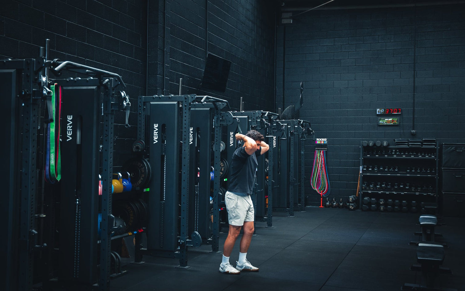 Row of VERVE Tori Functional Trainer Racks with plates, bands and a dumbbell rack in an Australian gym