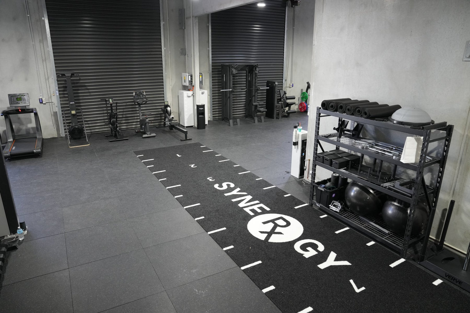 Completed commercial gym fit-out with flooring and equipment in place