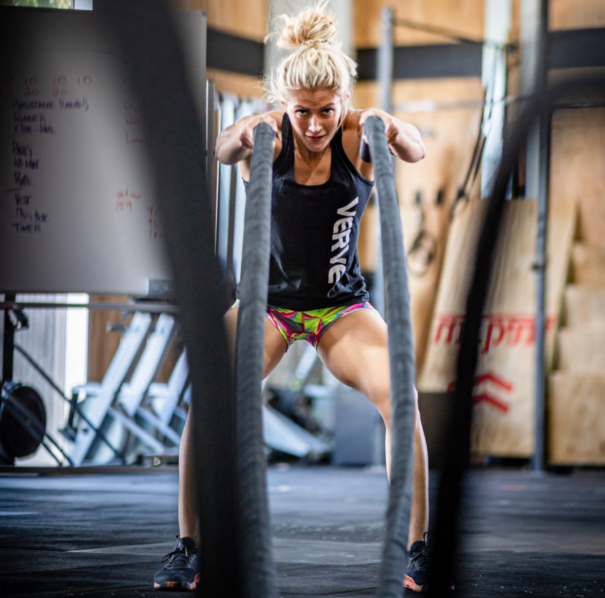 Athlete training with VERVE battle ropes in a functional gym