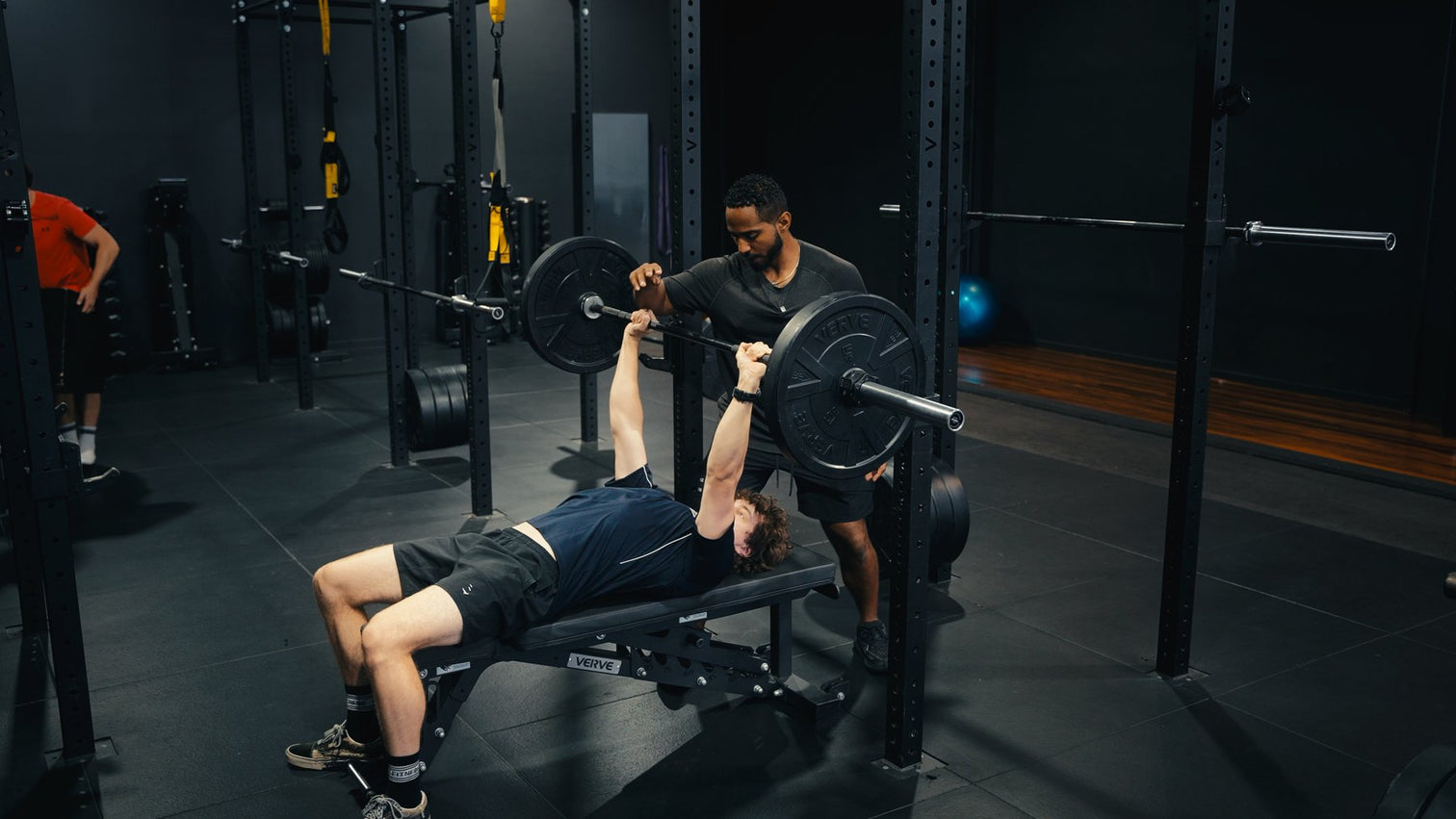 Lifter benching in a commercial VERVE gym fit-out