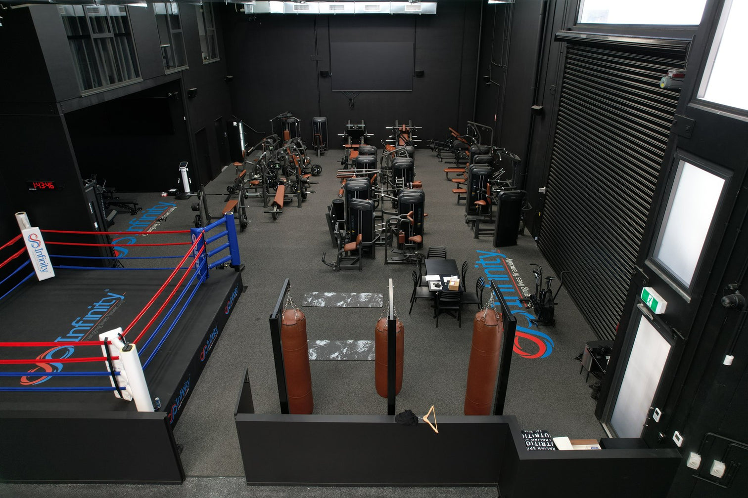 Commercial gym floor with plate-loaded machines, VERVE fit-out