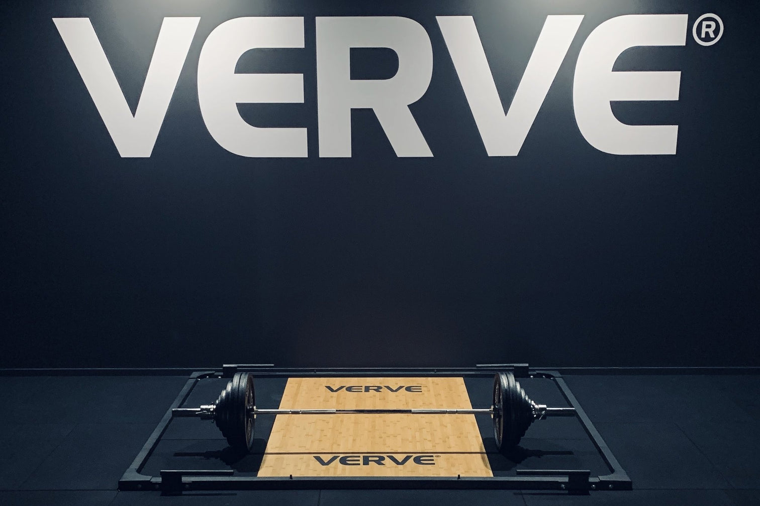 VERVE lifting platform with loaded barbell in the VERVE showroom