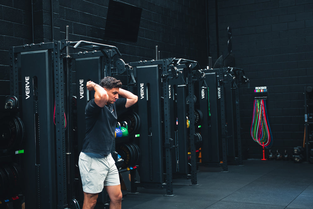 A row of VERVE Tori Functional Trainer Racks on a gym floor