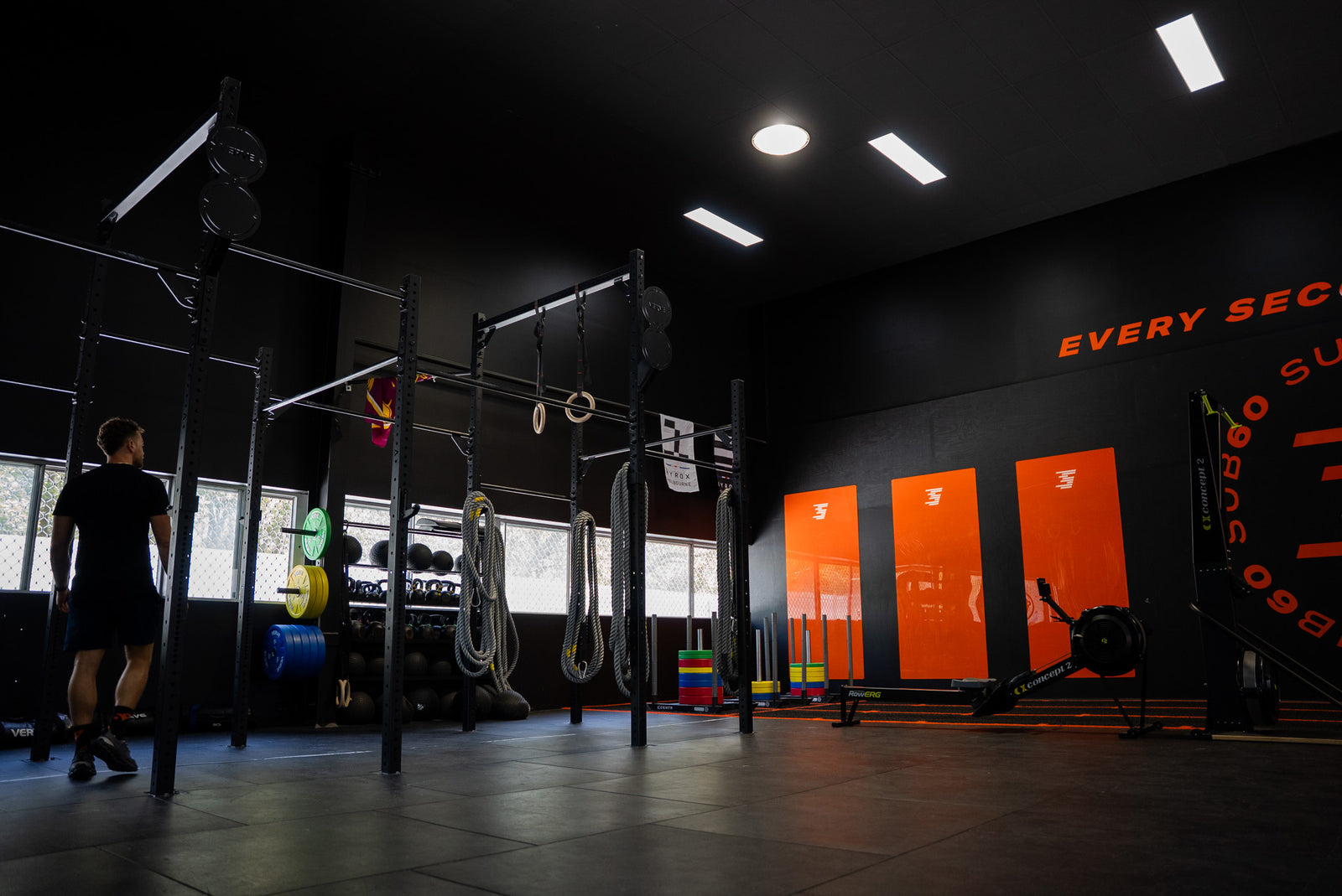 Empty commercial space before a gym fit-out, bare floor and walls ready for design