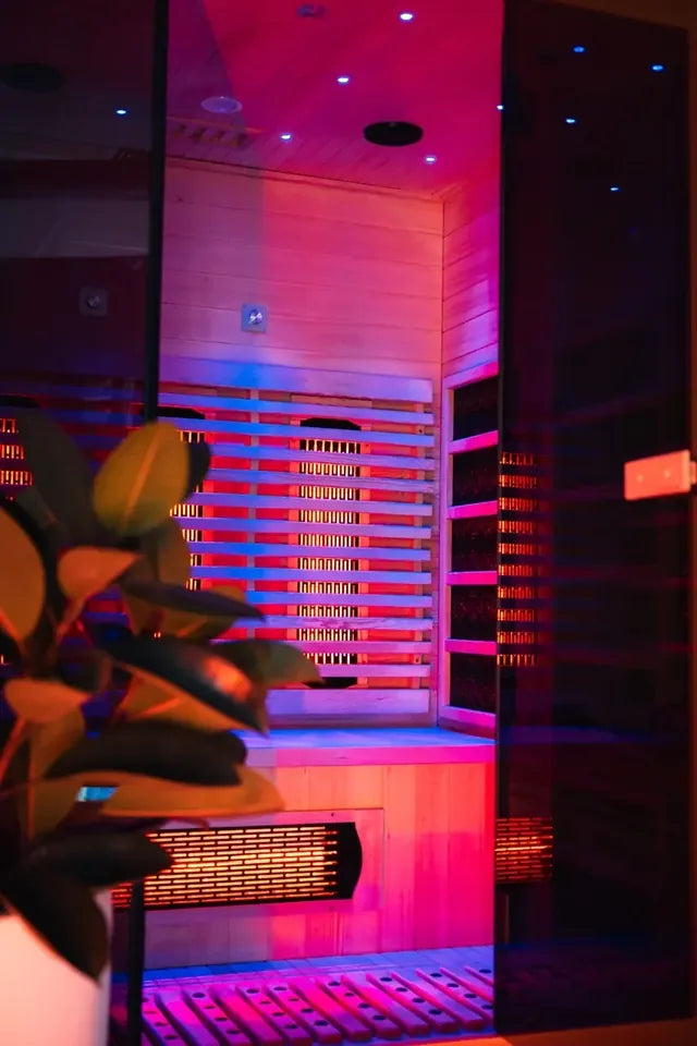 A MYSA 2 Person infrared sauna lit up at night